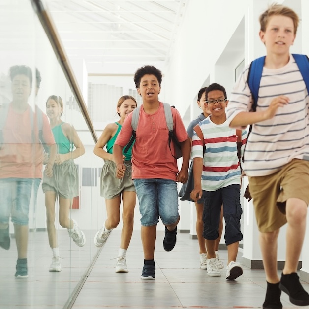 Kids running down a hallway